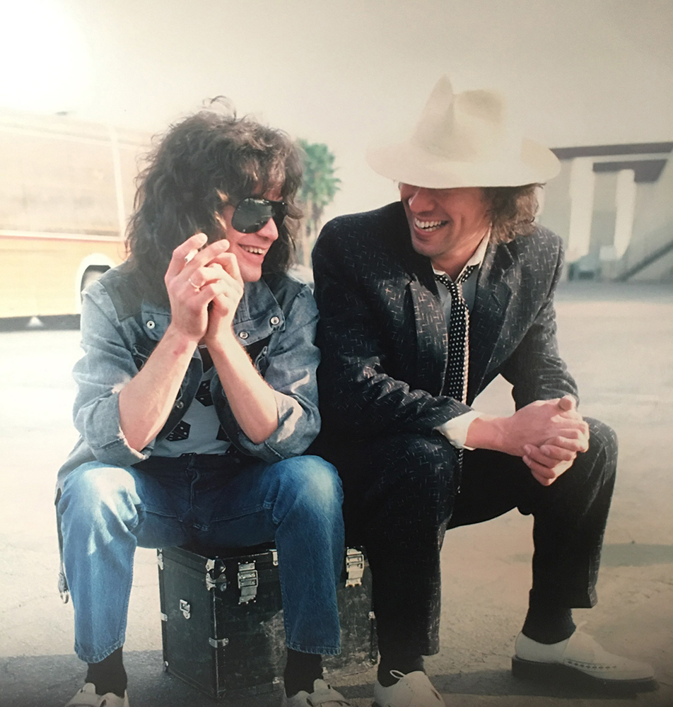 Eddie and Alex share a laugh at the airport